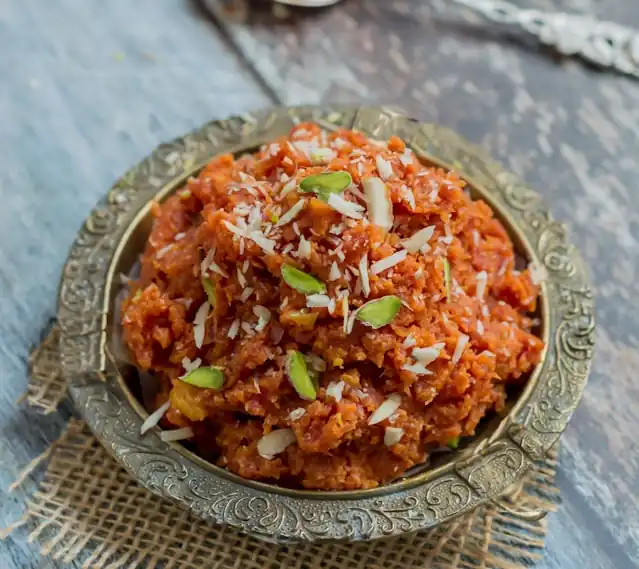 Saffron_Carrot_Halwa_with_Pistachios_Sweet_Treat_Delicious_Dessert_Saffron_Infused_Flavor_Carrot_Halwa_Aromatic_Delight_Nutritious_Snack_Natural_Ingredients_Wholesome_Cooking_Rich_Texture_Satisfying_Bite_Homemade_Ayurvedic_Delicacy_Pistachio_Crunch_Nourishing_Treat_Ayurvedic_Food_Ayurveda